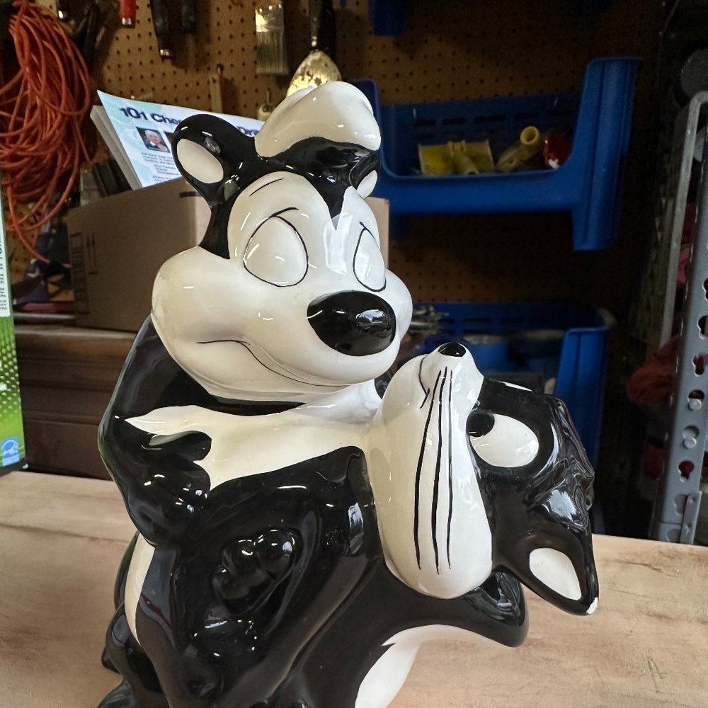 Pepe Le Pew and Penelope Piggy Bank